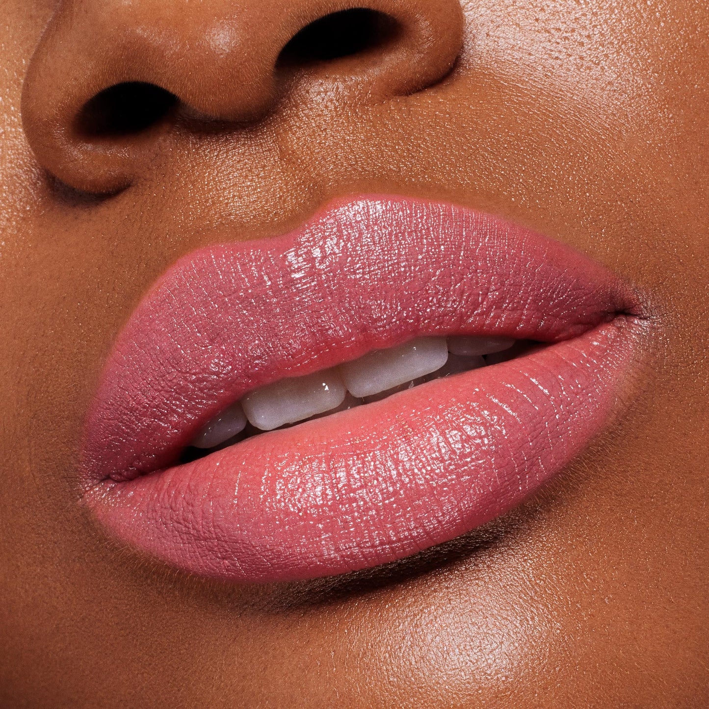 Lips wearing ColourPop Lippie Stix in Felt Cute, a creamy soft pink, reflecting a glossy satin sheen; extreme close-up shows full, even coverage and smooth, hydrated texture for a natural everyday lip look.
